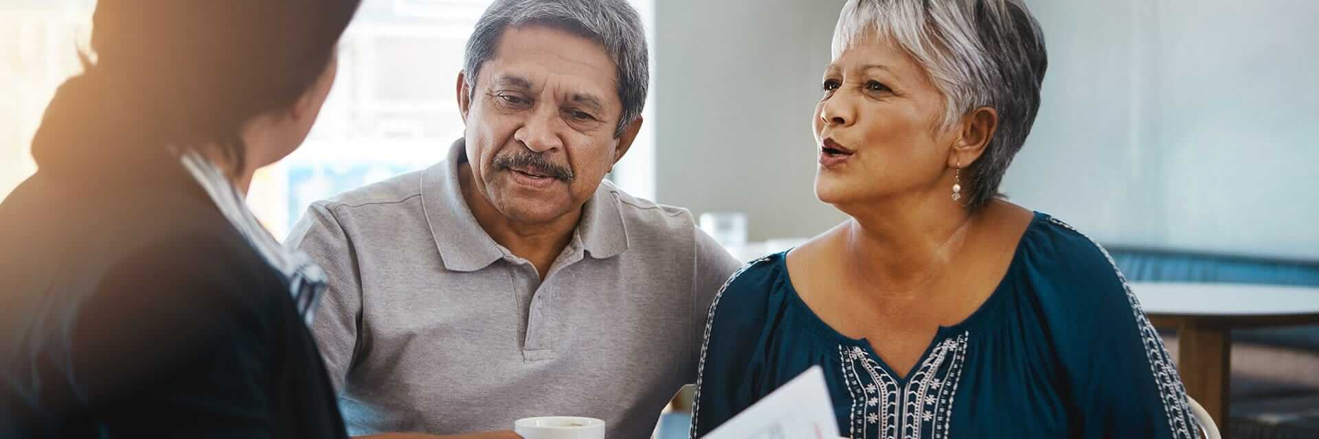 Meeting with a financial professional to review their options as they plan for the future.