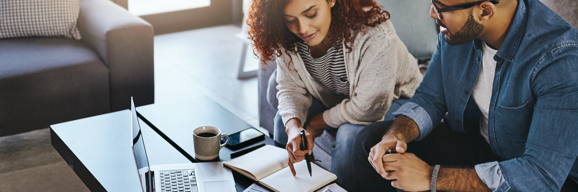 Two individuals reviewing financials.
