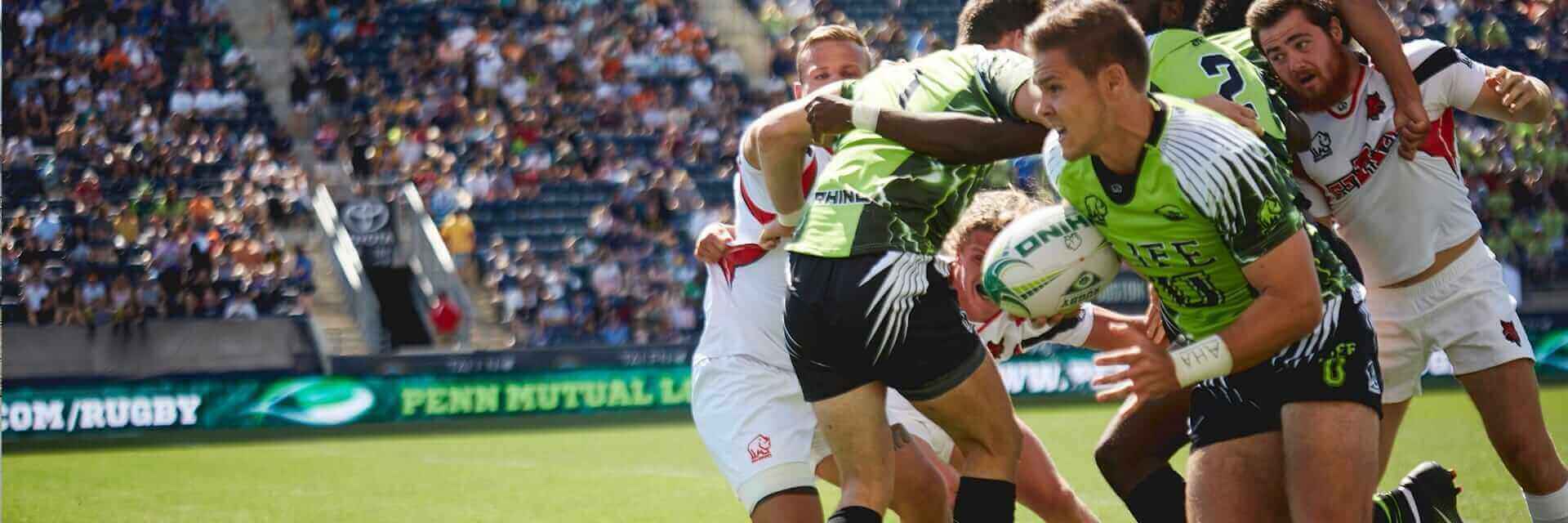 A team of rugby players actively engaged in their sport.